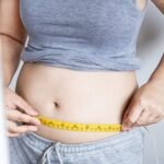 7 causes of belly fat (& how to reduce it)